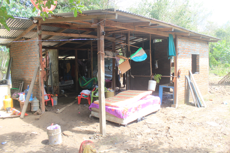 Many homes were partially destroyed, with one or several walls washed away by rushing flood waters. Photo by Javier Baldovinos.